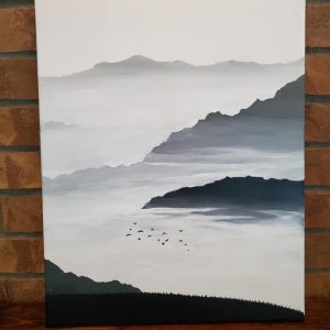 Painting of mountains in a fog